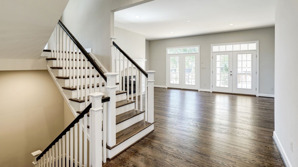 The open stair into the Family Room in the Grayson on Fallsgate Homesite 4. Some optional features shown.