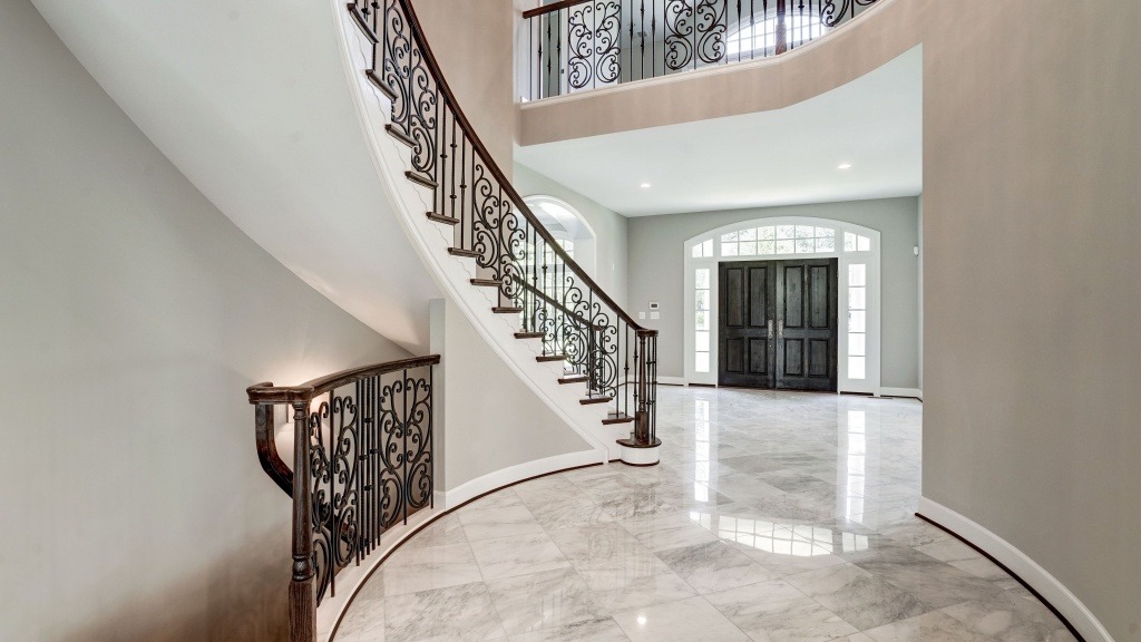 The large format tile in the dramatic foyer of a Gulick | One custom home.