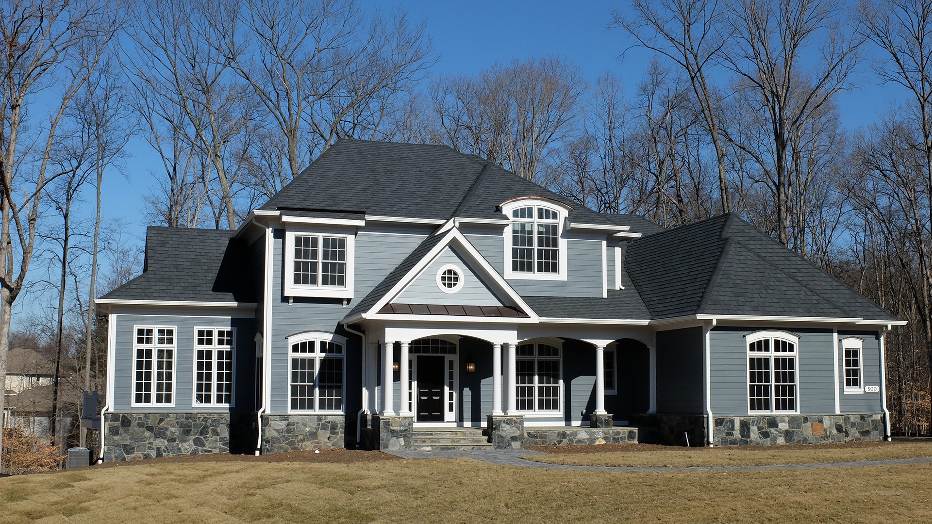 A custom front elevation on a Gulick | One semi-custom Grayson in Great Falls.