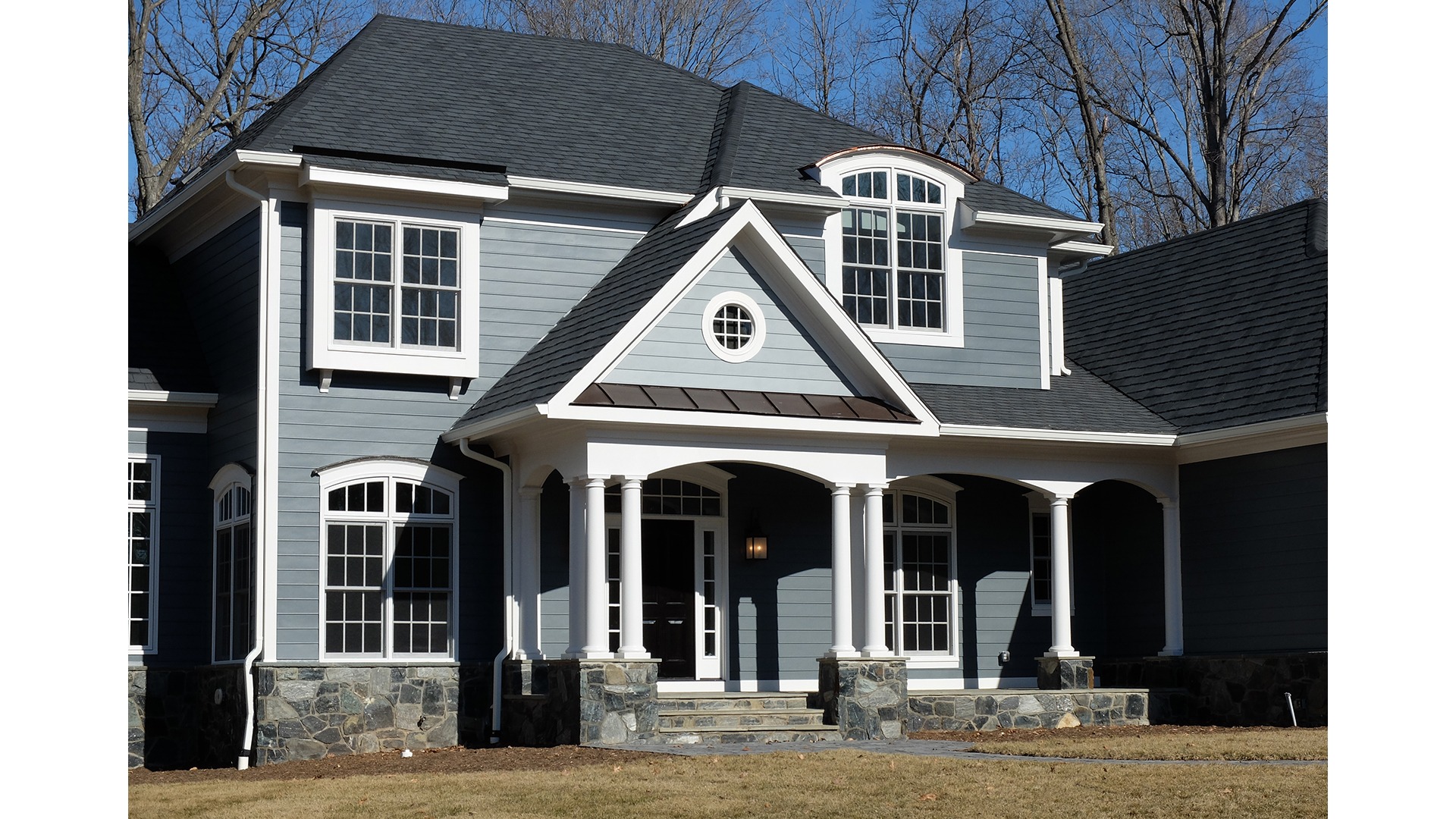 A custom front elevation on a Gulick | One semi-custom Grayson in Great Falls.