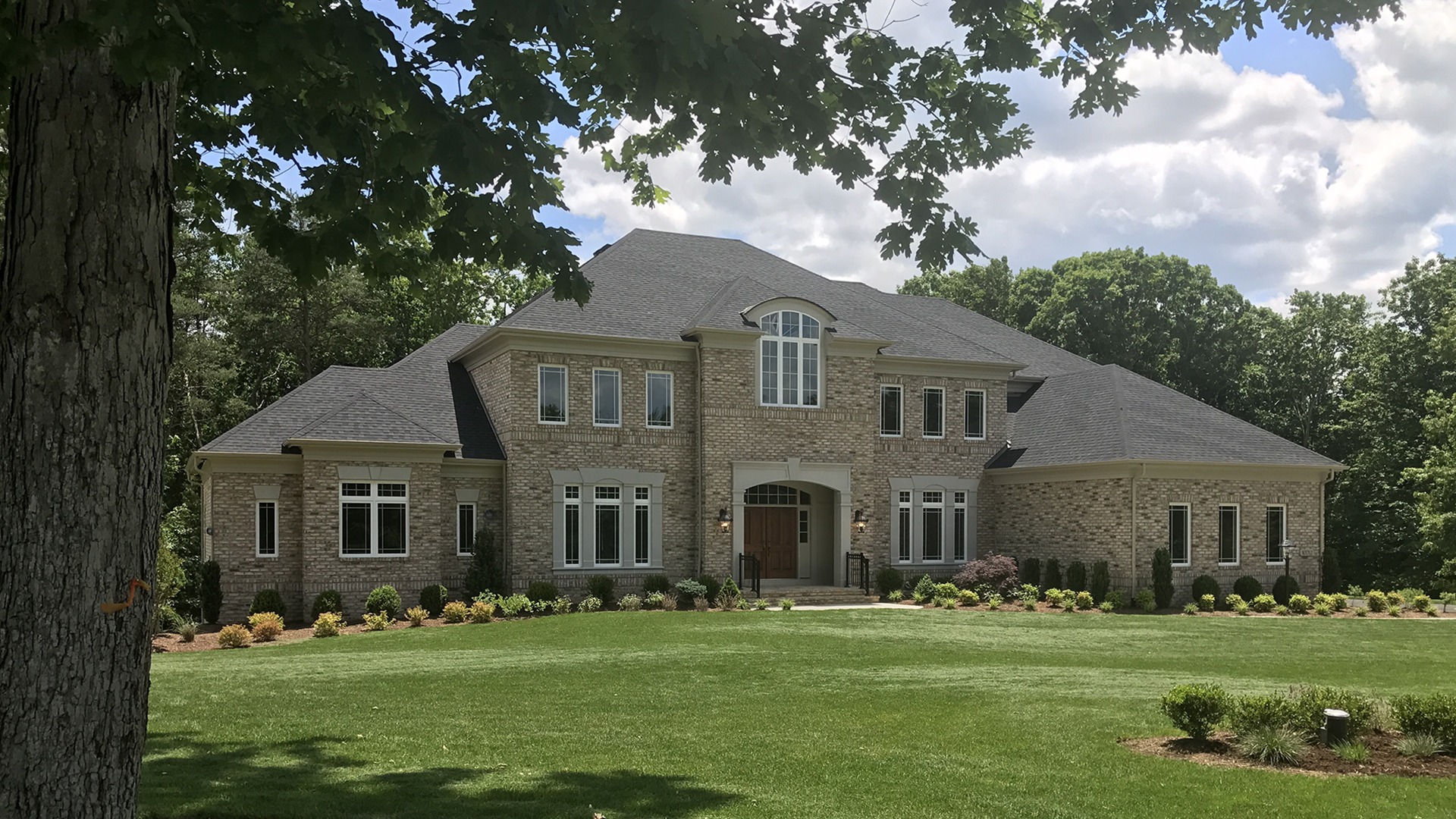 The exterior of the Winthrop with First Floor Master built on Thompson's Crossing homesite 3. Some options shown.