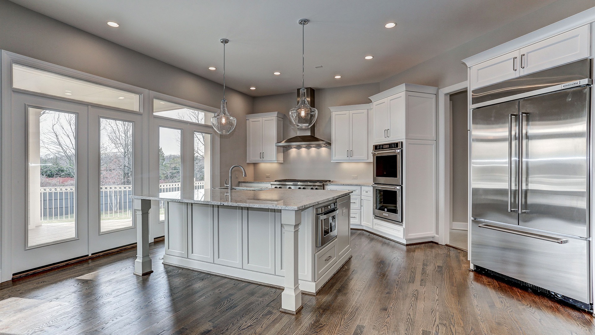The sunlit, custom designer Kitchen in the Winthrop on Fallsgate Homesite 2. Some optional features shown.
