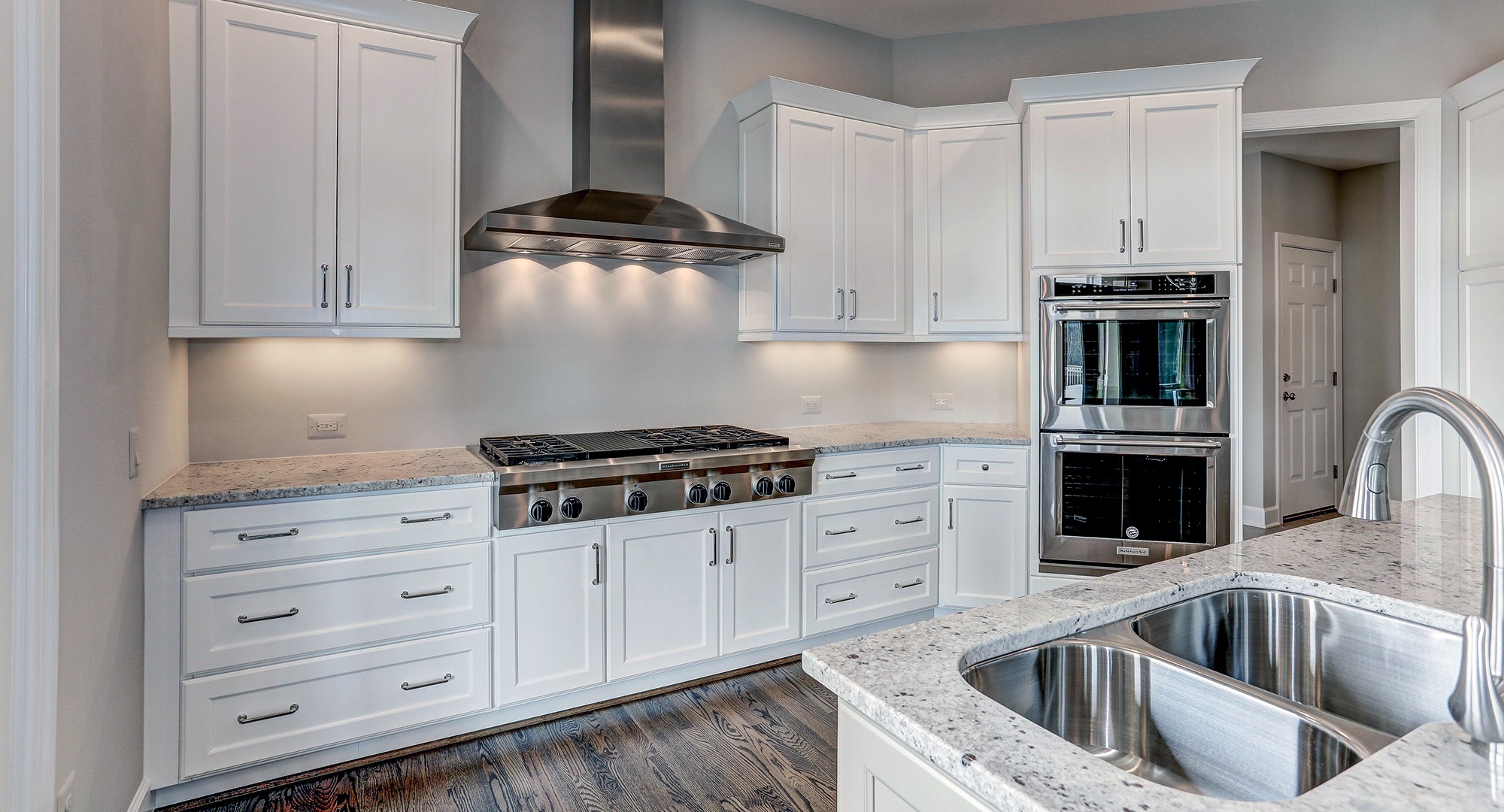 The sunlit, custom designer Kitchen in the Winthrop on Fallsgate Homesite 2. Some optional features shown.