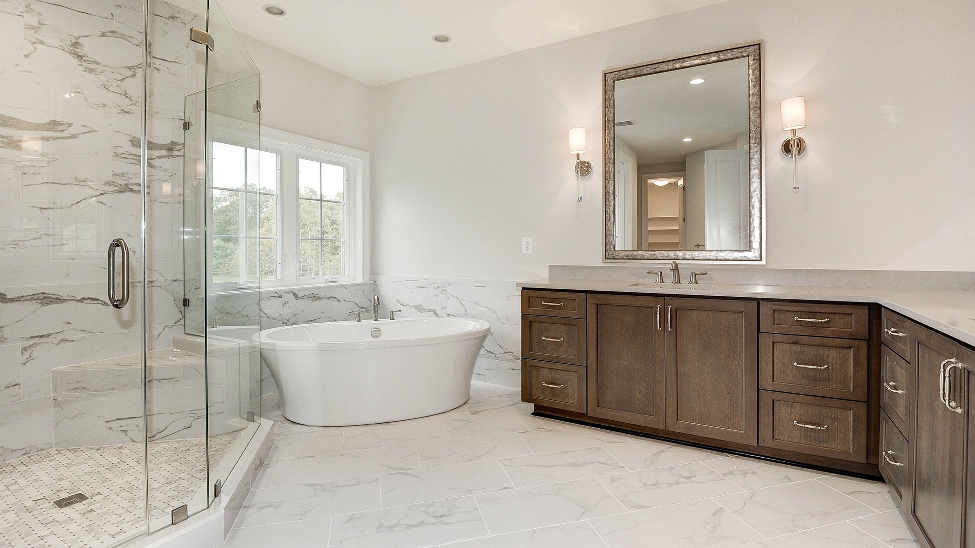 Luxury Owner's Bath with free-standing tub and frameless shower