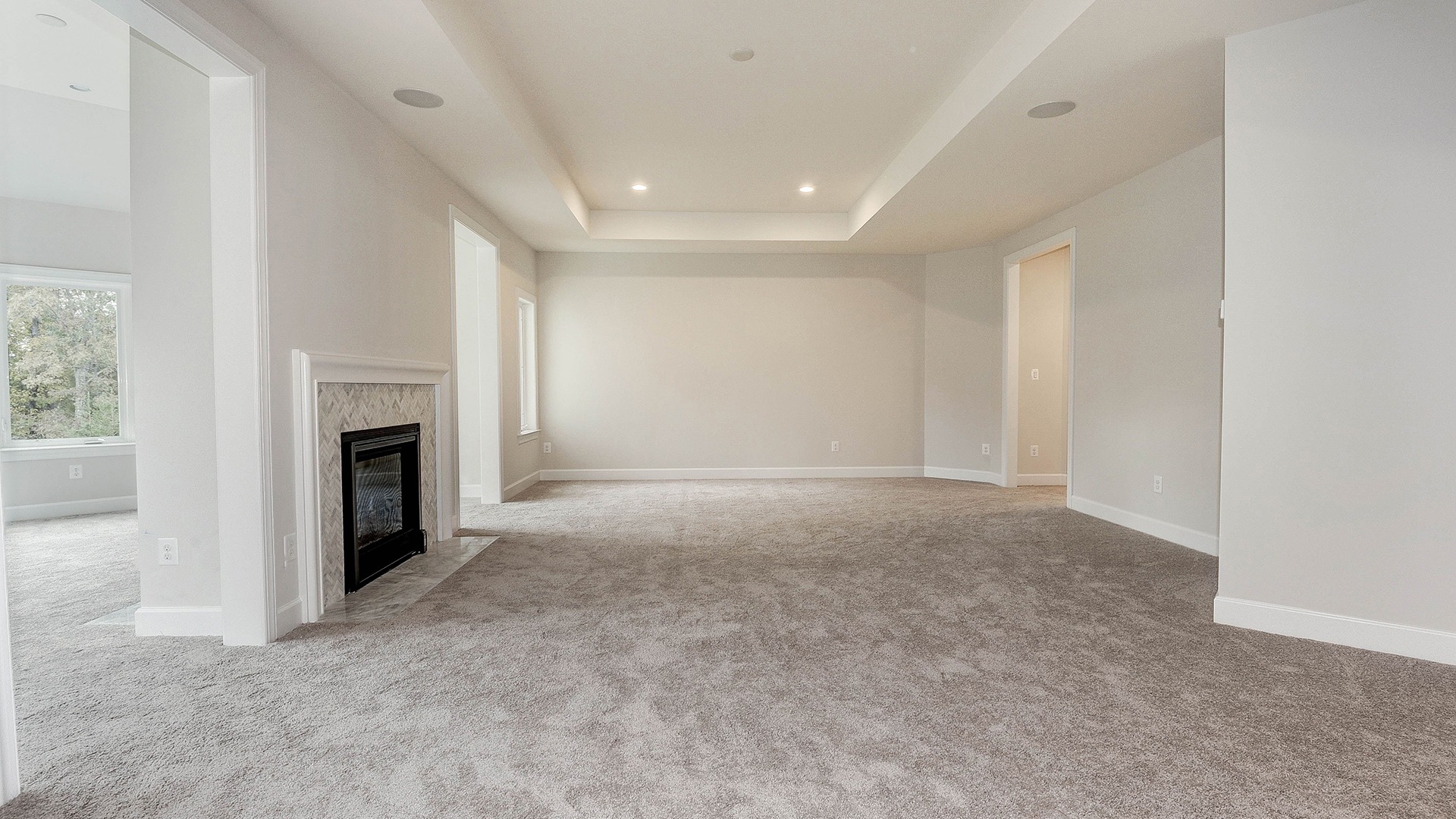 A revised Owner's Bedroom with Two Side Fireplace to a Sunlit Sitting Room.