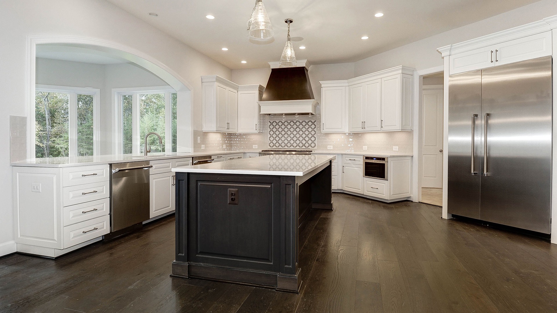 The dramatic sunlit opening between the Optional Sunroom and Kitchen in the Summerwood Series Winthrop