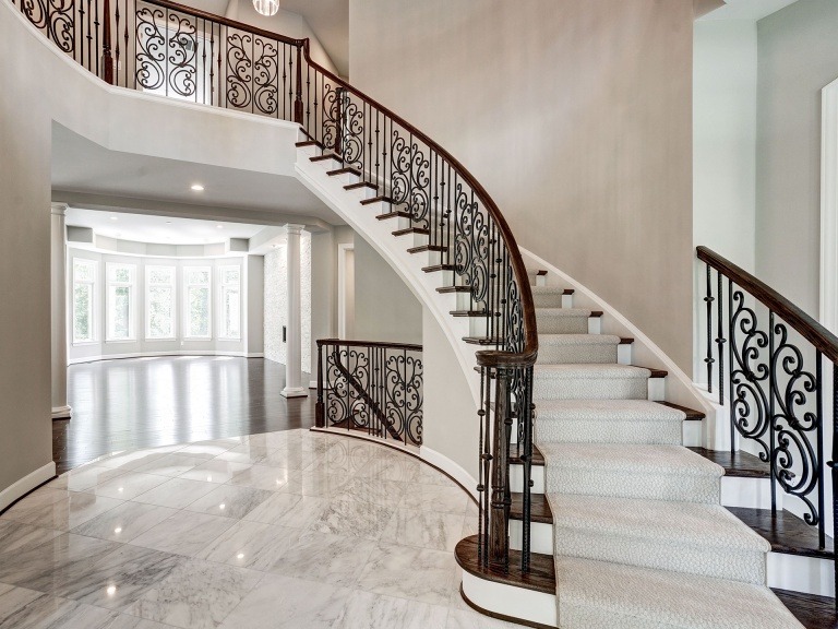 Large format tile in the dramatic Foyer in a Gulick | One custom home.