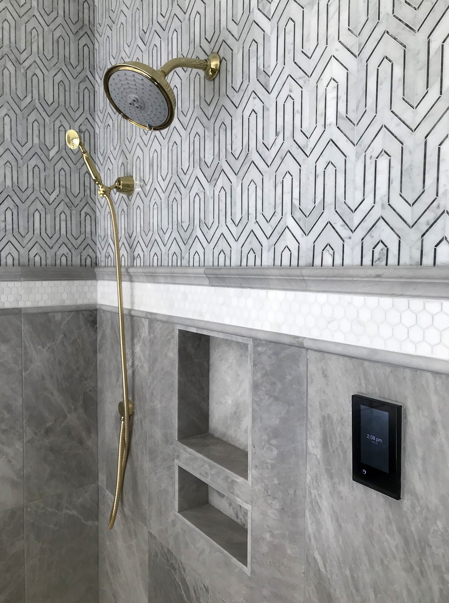 A shower with patterned tile.